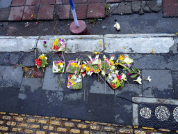 `Canang Sari` offering on the street in front of the Ubud Tourist Information Centre at the crossing of the Jalan Monkey Forest street and the Jalan Raya Ubud street