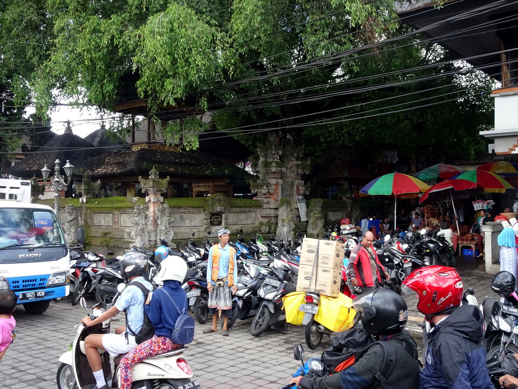 Scooters in front of the Pura Melanting Ubud temple at the Jalan Raya Ubud street