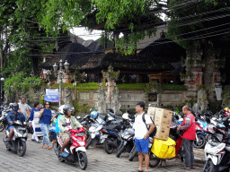 Scooters in front of the Pura Melanting Ubud temple at the Jalan Raya Ubud street