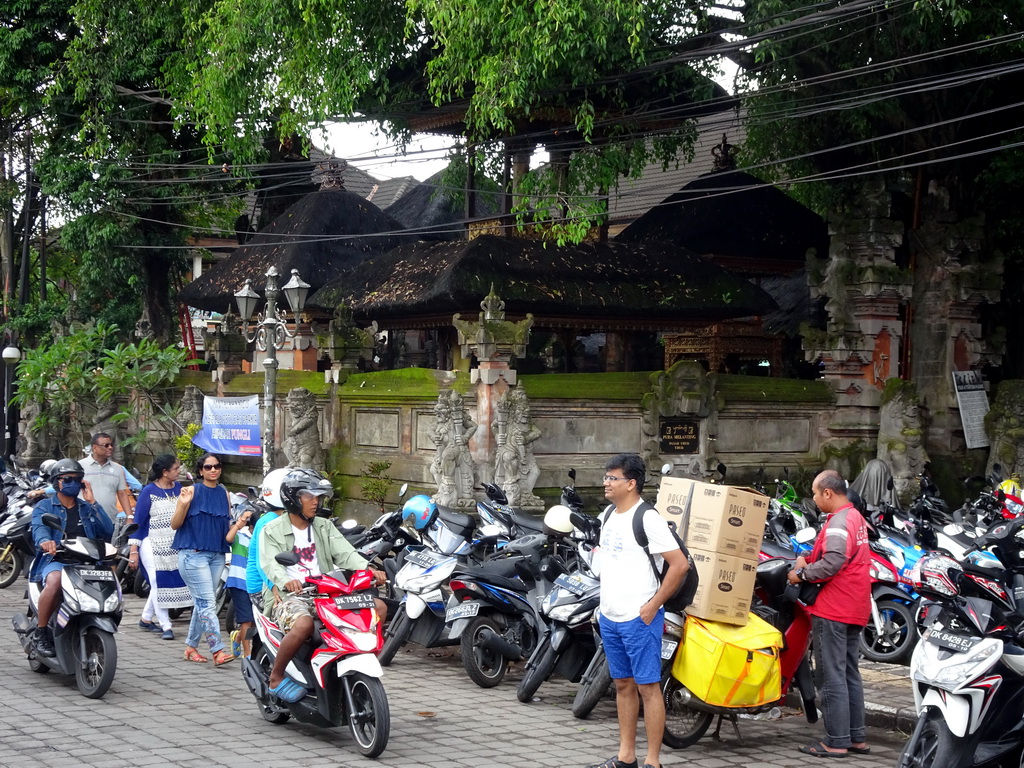 Scooters in front of the Pura Melanting Ubud temple at the Jalan Raya Ubud street