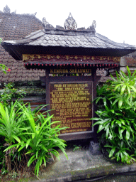 Sign at the entrance to the Pura Taman Saraswati temple