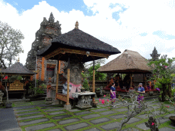 Statue, gate and pavilion at the Pura Taman Saraswati temple