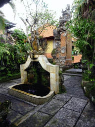 Gate and fountain at the Puri Saraswati Bungalows