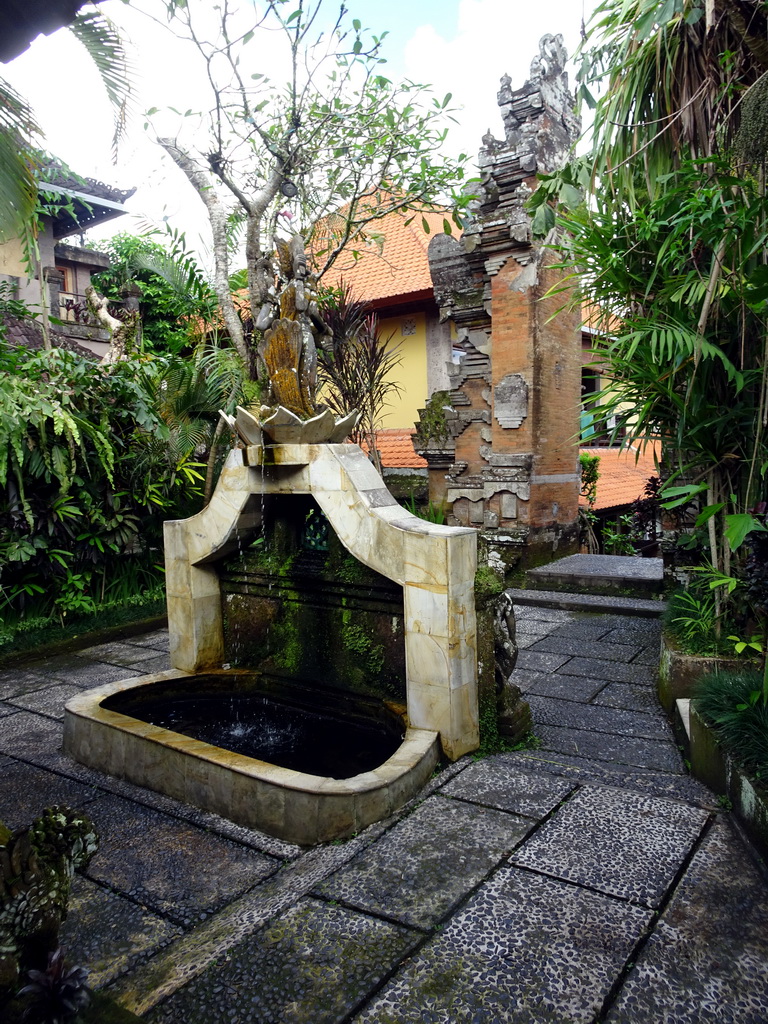 Gate and fountain at the Puri Saraswati Bungalows