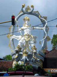 Large statue at the crossing of the Jalan Raya Ubud street and the Jalan Cokorda Gede Rai street, viewed from the taxi