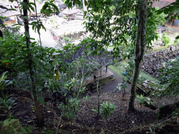 Ruins, the Hariti Pavilion, the bathing place and the Pura Taman temple at the Goa Gajah temple, viewed from the path from the entrance