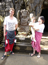 Tim, Miaomiao and Max with a statue in front of the `Elephant Cave` at the Goa Gajah temple