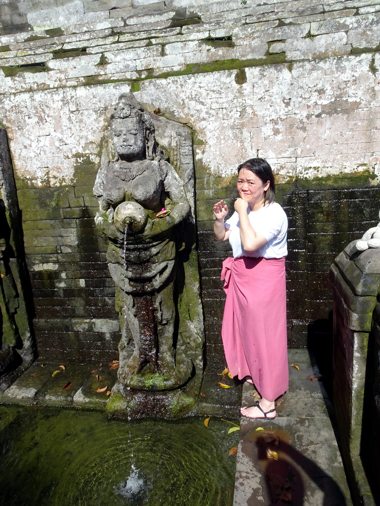 Miaomiao at a fountain at the bathing place at the Goa Gajah temple