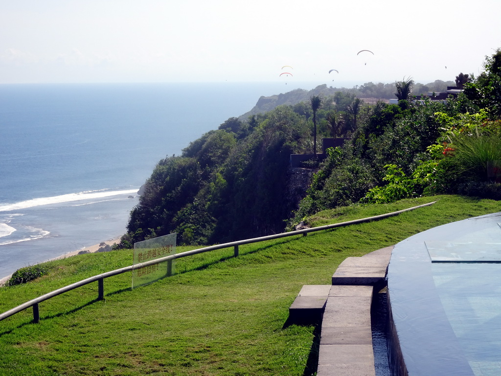 Cliffs and parasailers, viewed from the Tirtha Wedding Chapel