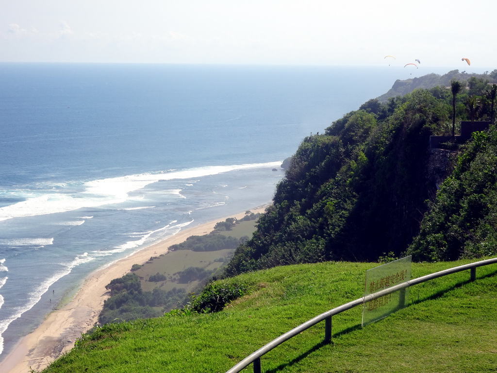 Cliffs, beach and parasailers, viewed from the Tirtha Wedding Chapel