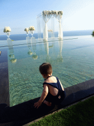 Max at the pond in front of the altar at the Tirtha Wedding Chapel