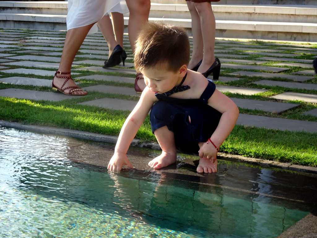 Max at the pond in front of the altar at the Tirtha Wedding Chapel