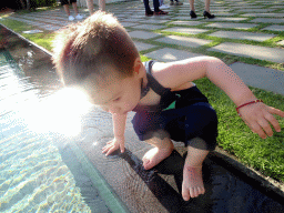 Max at the pond in front of the altar at the Tirtha Wedding Chapel