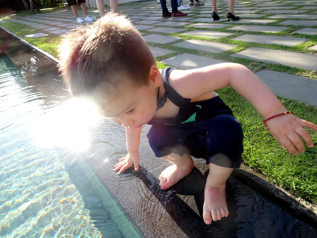 Max at the pond in front of the altar at the Tirtha Wedding Chapel