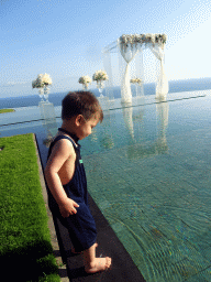 Max at the pond in front of the altar at the Tirtha Wedding Chapel