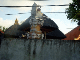 Temple at the Jalan Raya Uluwatu street at Ungasan, viewed from the taxi to Nusa Dua