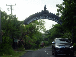 Welcome gate to the Pura Luhur Uluwatu temple, viewed from the taxi from Beraban