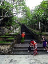 Miaomiao and Max at a staircase at the Pura Luhur Uluwatu temple