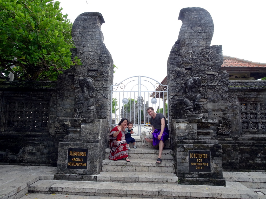 Tim, Miaomiao and Max at a gate at the Pura Luhur Uluwatu temple