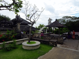Pavilions and Monkey Statue at the Pura Luhur Uluwatu temple