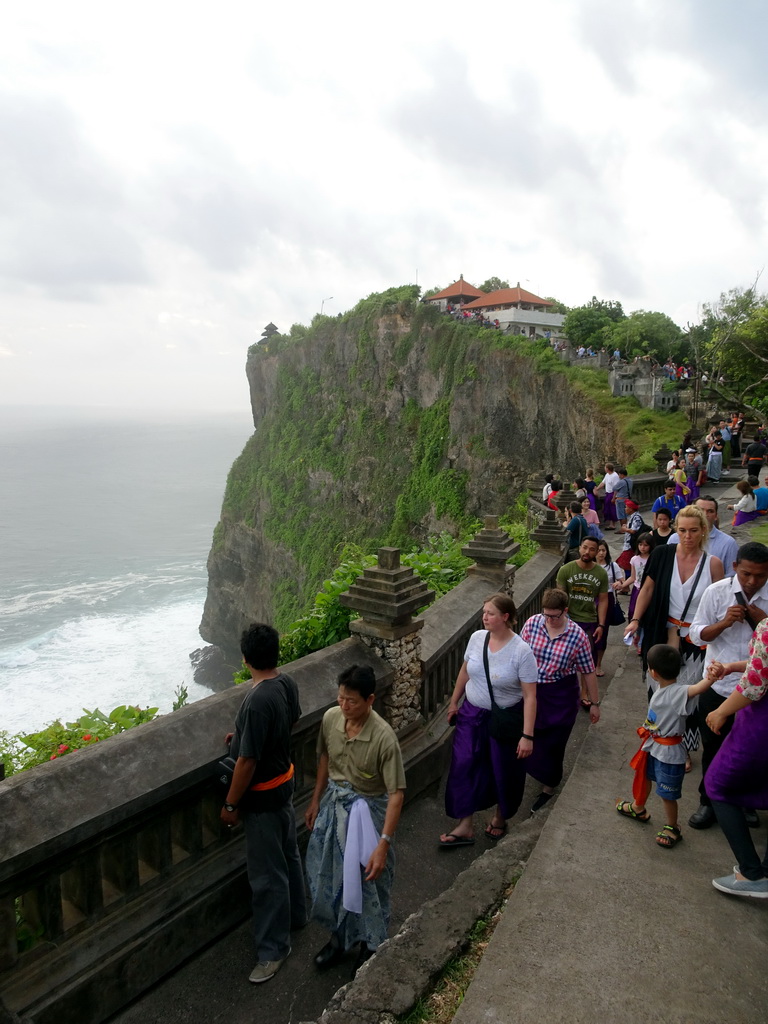Cliff with pavilions at the Pura Luhur Uluwatu temple, viewed from the path to the Amphitheatre