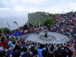 The Amphitheatre of the Pura Luhur Uluwatu temple, with people performing the Sanghyang dance during the Kecak and Fire Dance