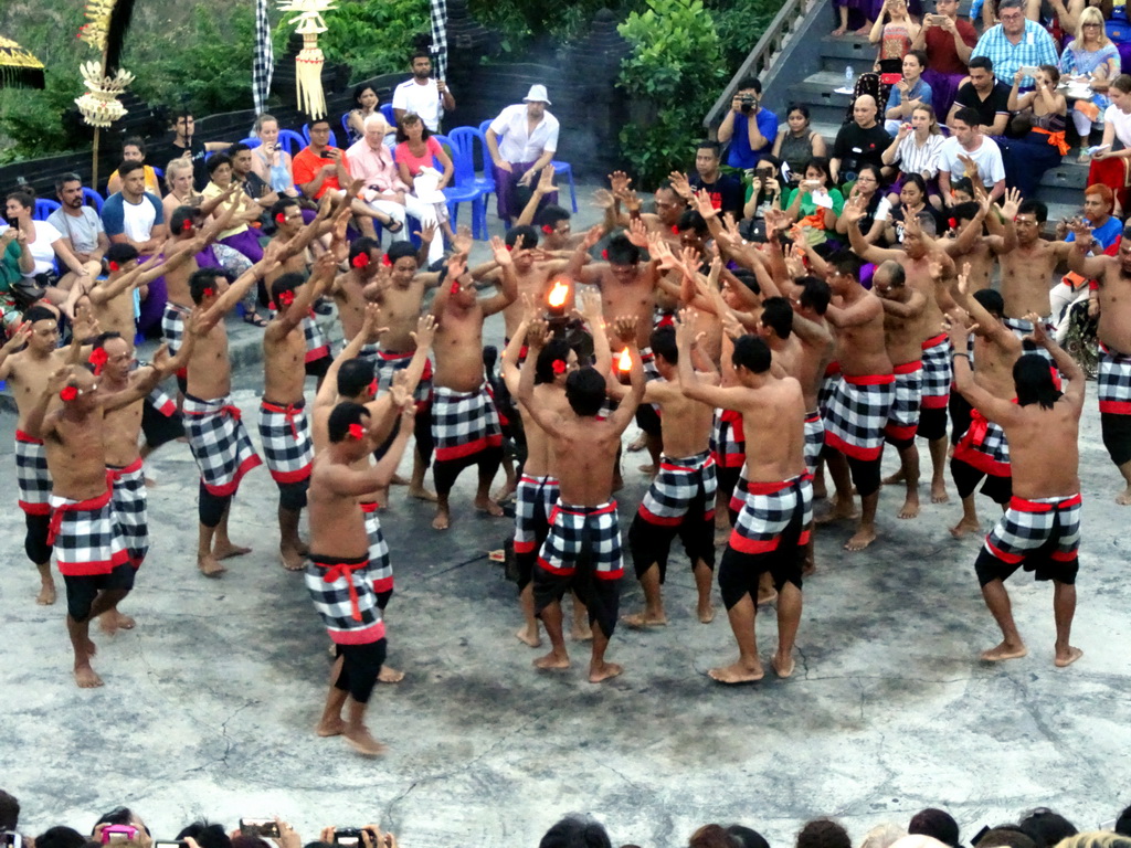 People performing the Sanghyang dance during the Kecak and Fire Dance at the Amphitheatre of the Pura Luhur Uluwatu temple