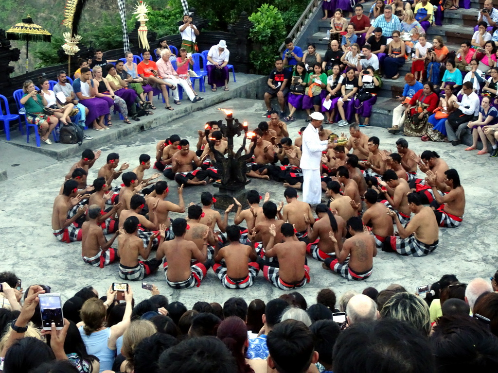 People performing the Sanghyang dance during the Kecak and Fire Dance at the Amphitheatre of the Pura Luhur Uluwatu temple