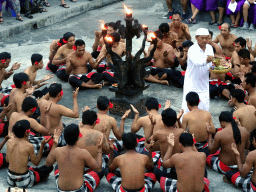 People performing the Sanghyang dance during the Kecak and Fire Dance at the Amphitheatre of the Pura Luhur Uluwatu temple