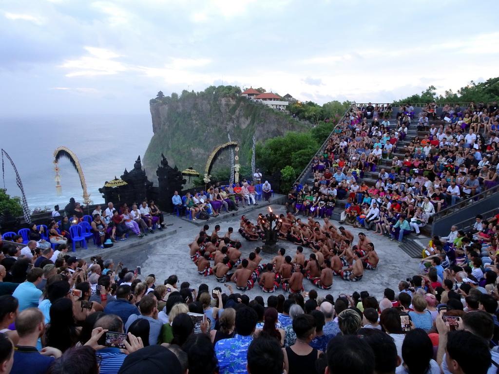 The Amphitheatre of the Pura Luhur Uluwatu temple, with people performing the Sanghyang dance during the Kecak and Fire Dance