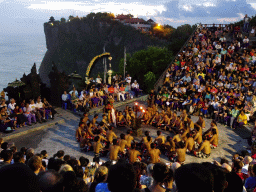 The Amphitheatre of the Pura Luhur Uluwatu temple, with Rahwana during Act 2 of the Kecak and Fire Dance, at sunset