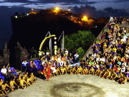 The Amphitheatre of the Pura Luhur Uluwatu temple, with a Giant during Act 4 of the Kecak and Fire Dance, by night