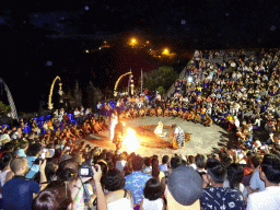 The Amphitheatre of the Pura Luhur Uluwatu temple, with Giants putting Haruman on fire during Act 4 of the Kecak and Fire Dance, by night