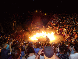 The Amphitheatre of the Pura Luhur Uluwatu temple, with Giants putting Haruman on fire during Act 4 of the Kecak and Fire Dance, by night