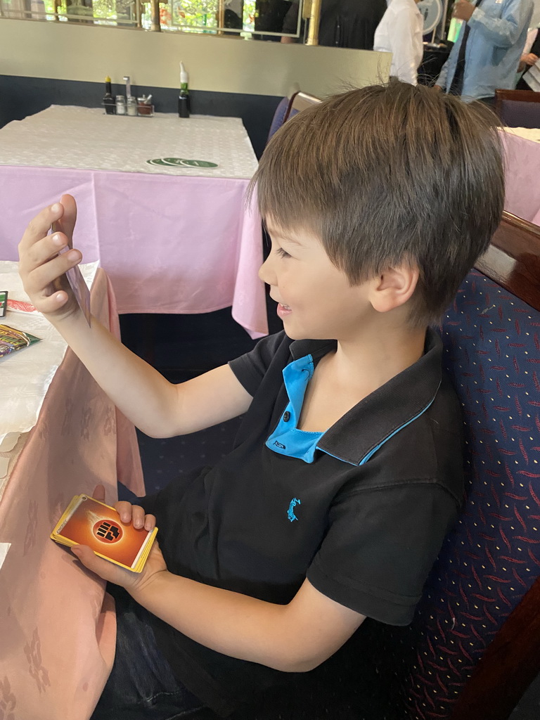 Max with Pokémon cards at the Tai Soen restaurant at the Hoog Catharijne shopping mall