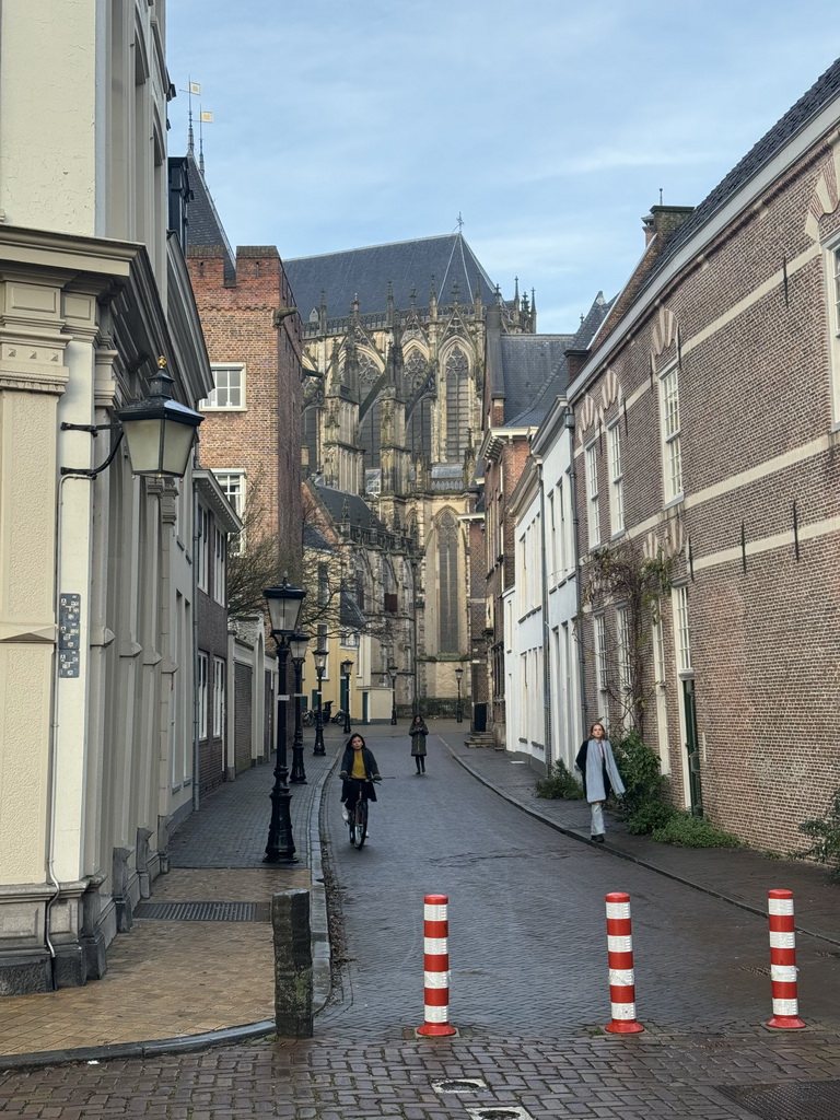 The Achter De Dom street and the southeast side of the Domkerk church, viewed from the Pausdam square