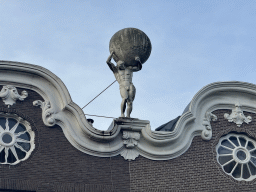 Statue of Atlas on top of a building at the Nieuwgracht street