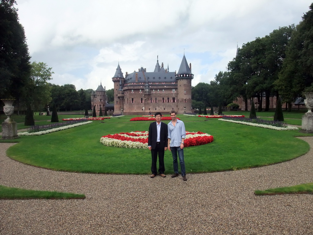 Tim and Miaomiao`s friend at the Romeinse Tuin garden, with a view on the east side of the De Haar Castle and the Châtelet building