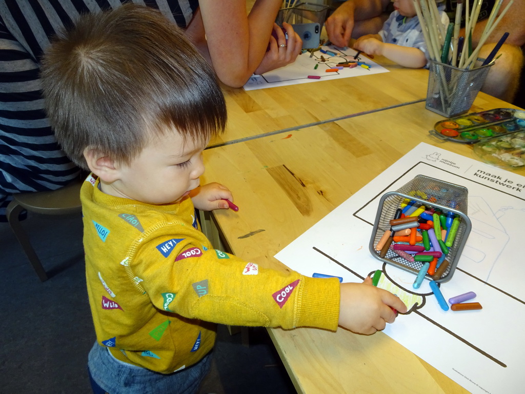Max playing with crayons in the Art Room at the upper floor of the Nijntje Museum