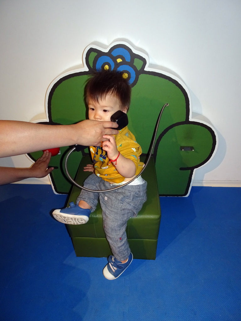 Max with a telephone at the Museum Room at the ground floor of the Nijntje Museum