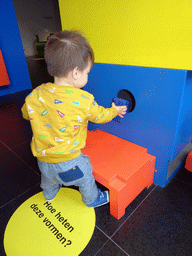 Max playing with a puzzle at the Museum Room at the ground floor of the Nijntje Museum