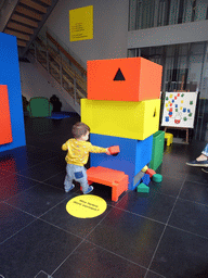 Max playing with a puzzle at the Museum Room at the ground floor of the Nijntje Museum