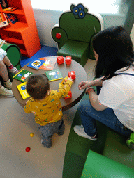 Miaomiao and Max playing with blocks at Nijntje`s House at the ground floor of the Nijntje Museum