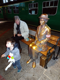 Max with his grandfather and a bronze statue at the `Treinen door de Tijd` exhibition at the Werkplaats hall of the Spoorwegmuseum