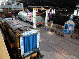 Old trains at the Werkplaats hall of the Spoorwegmuseum, viewed from the upper walkway