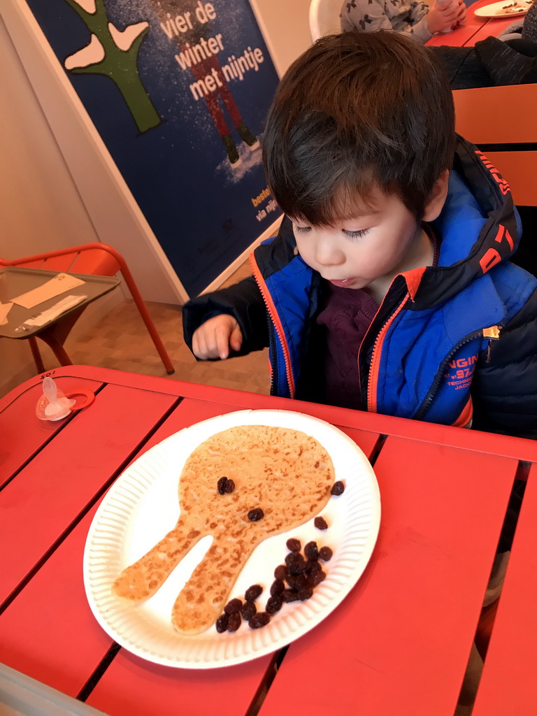 Max eating a pancake at the Museumcafé Centraal