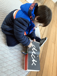 Max with a book about Dick Bruna at the upper floor of the Museum Shop of the Centraal Museum