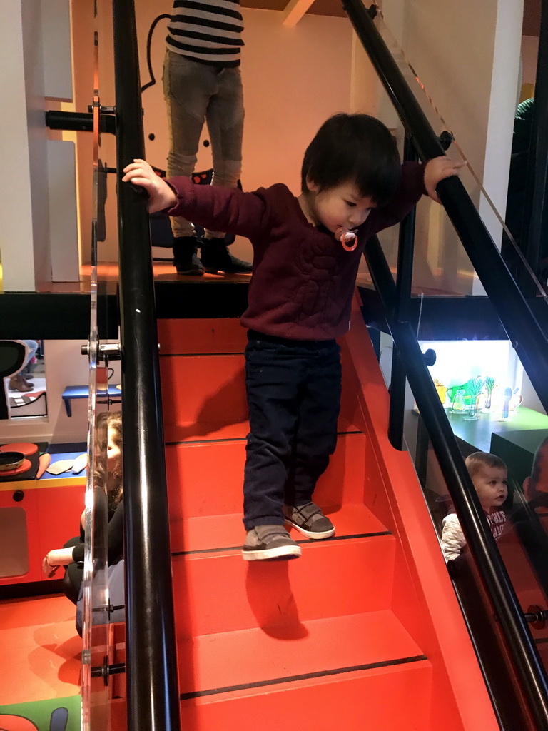 Max on the staircase of Nijntje`s House at the ground floor of the Nijntje Winter Museum