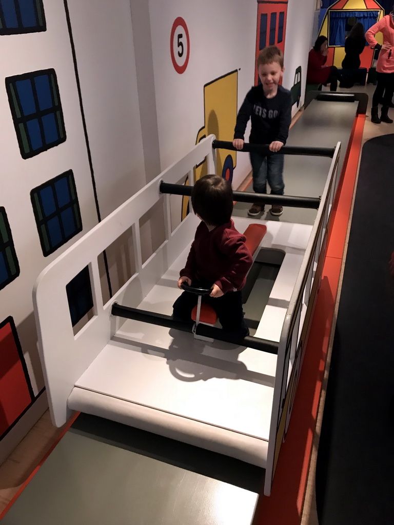 Max at a bus at the Traffic Room at the upper floor of the Nijntje Winter Museum