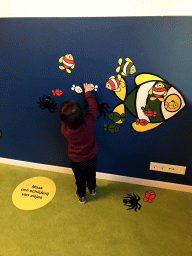 Max playing with cardboard fish at the Animal Room at the upper floor of the Nijntje Winter Museum